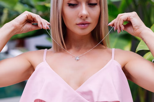 Woman Wearing Necklace in pink top