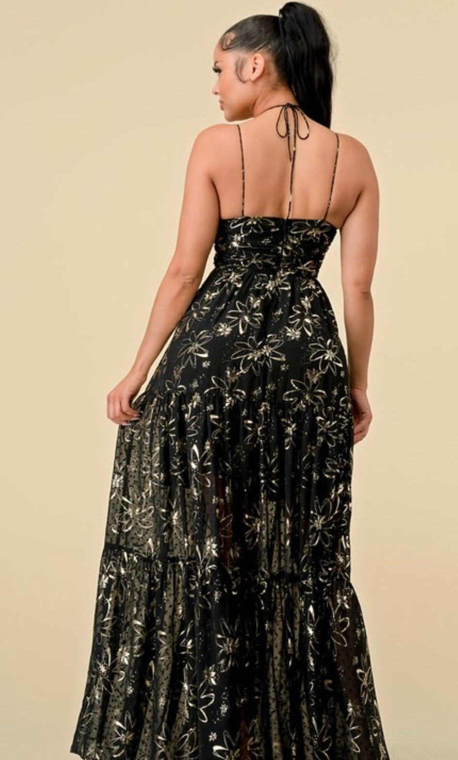 "Golden Goddess: Black and Gold Maxi Dress for a Sassy and Sophisticated Look"