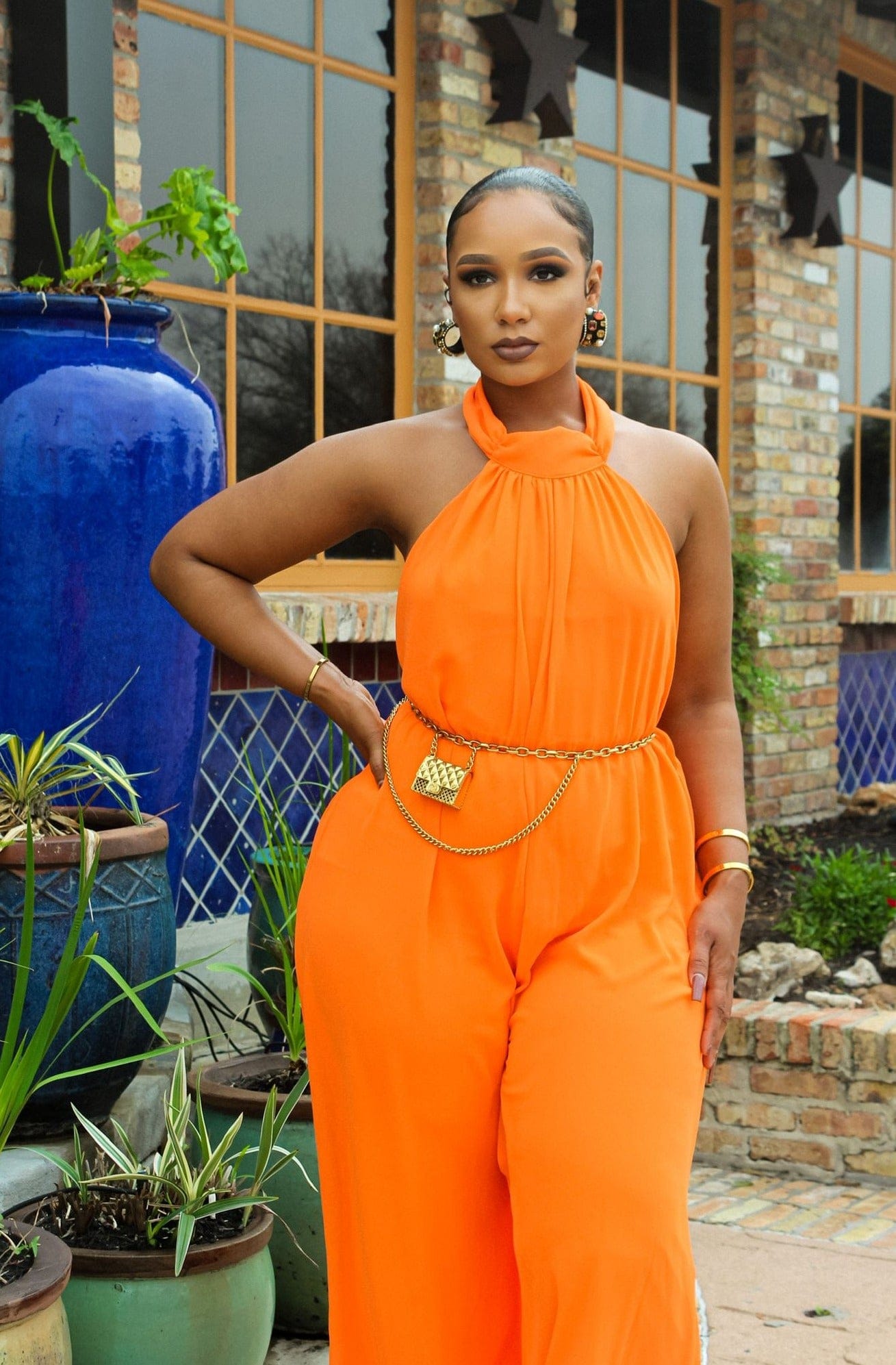 "Neon Orange Halter Jumpsuit: A Bright and Bold Look!"